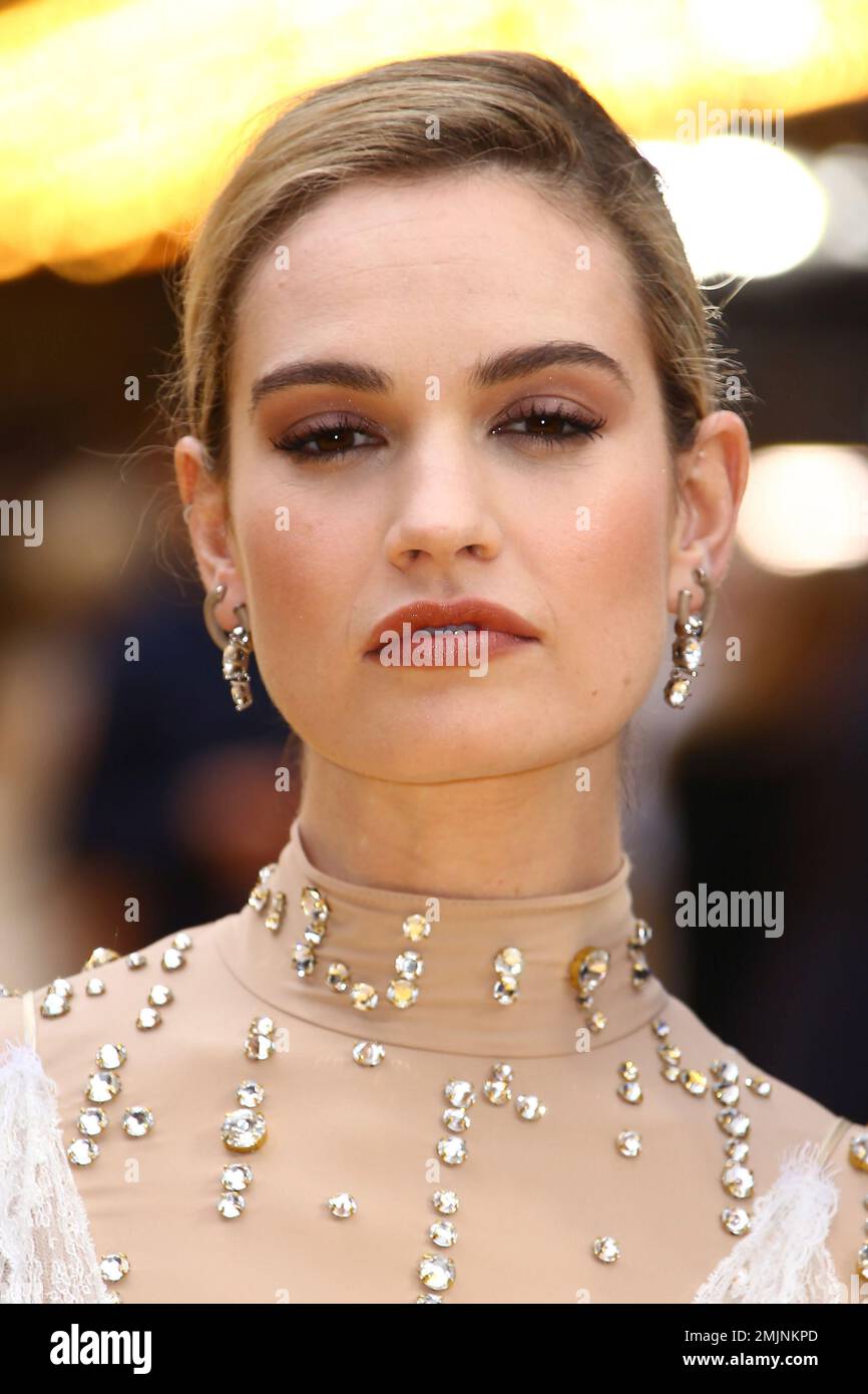 actress-lily-james-poses-for-photographers-upon-arrival-at-the-premiere
