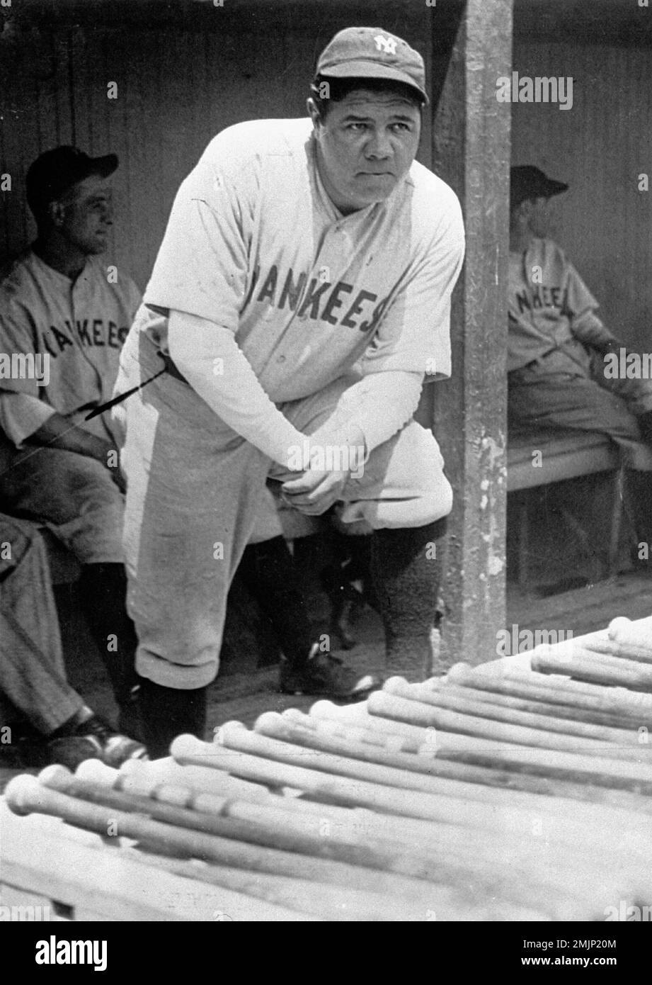 FILE - In this July 1929 file photo, New York Yankees' Babe Ruth, who was  injured, stands in the dugout during the baseball team's game at Cleveland.  A Babe Ruth road jersey