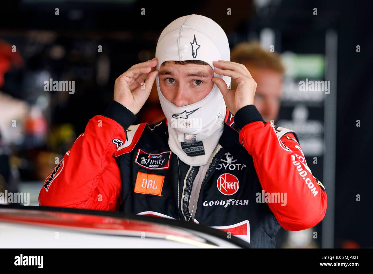 Christopher Bell prepares to get into his car for practice for a NASCAR Xfinity Series auto race, Saturday, June 15, 2019, at Iowa Speedway in Newton, Iowa. (AP Photo/Charlie Neibergall) Stock Photo