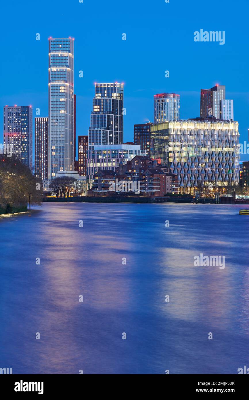 Nightime skyline of riverside skyscrapers beside the bridge at Vauxhall over the river Thames, London, England. Stock Photo