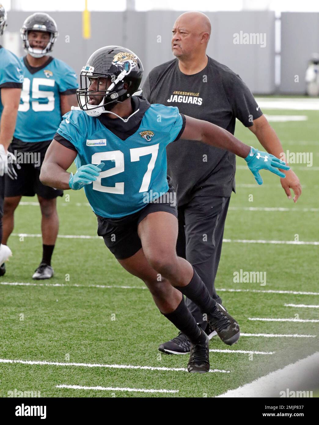 Jacksonville Jaguars running back Leonard (27) performs a