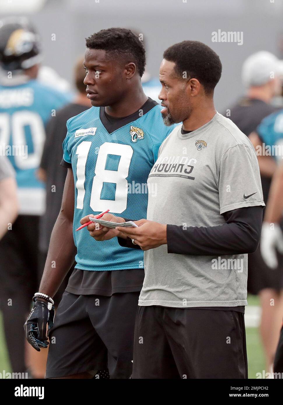 Jacksonville Jaguars wide receiver Chris Conley (18) talks with wide