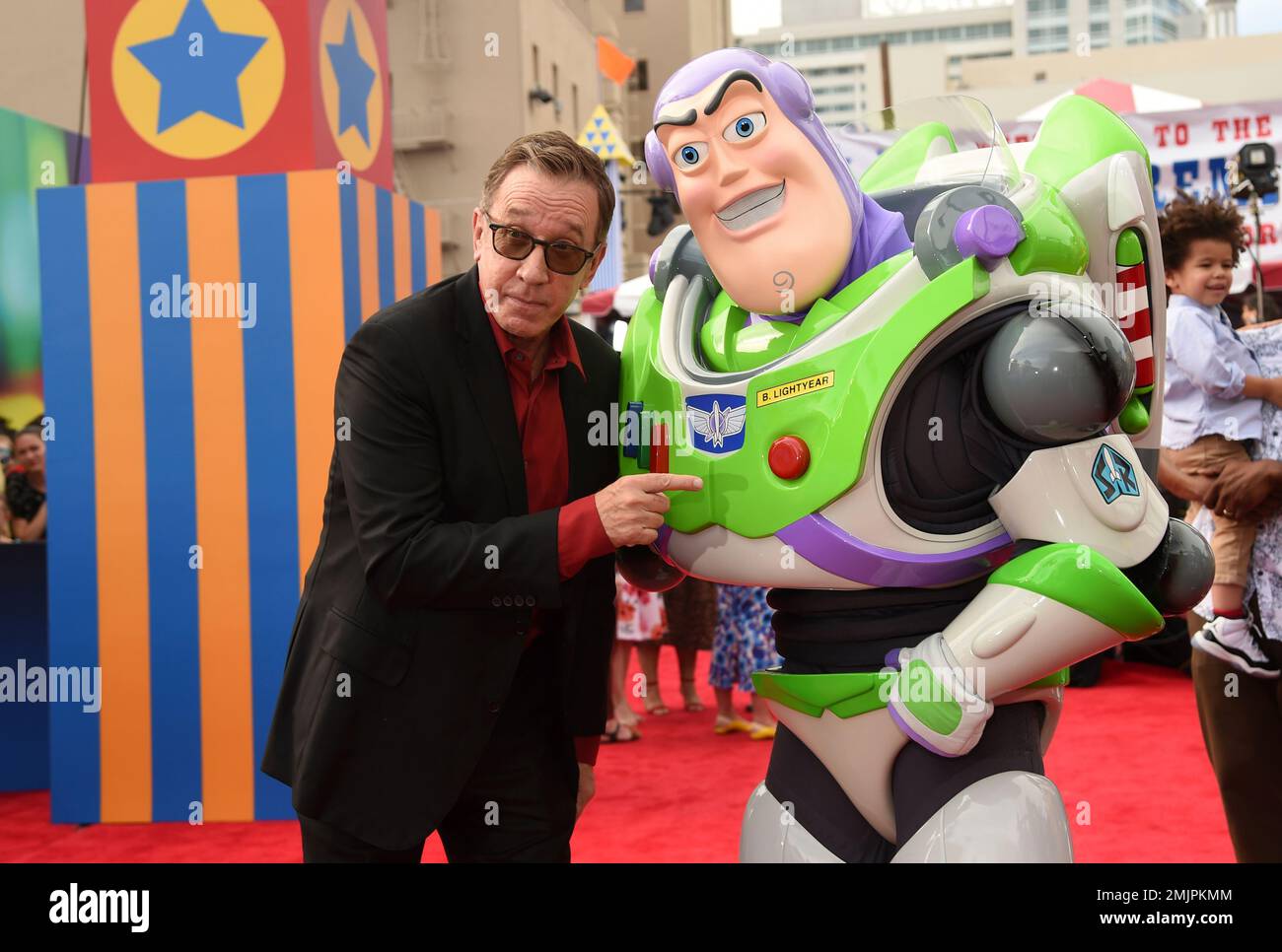 Voice cast member Tim Allen, left, poses with his character Buzz ...