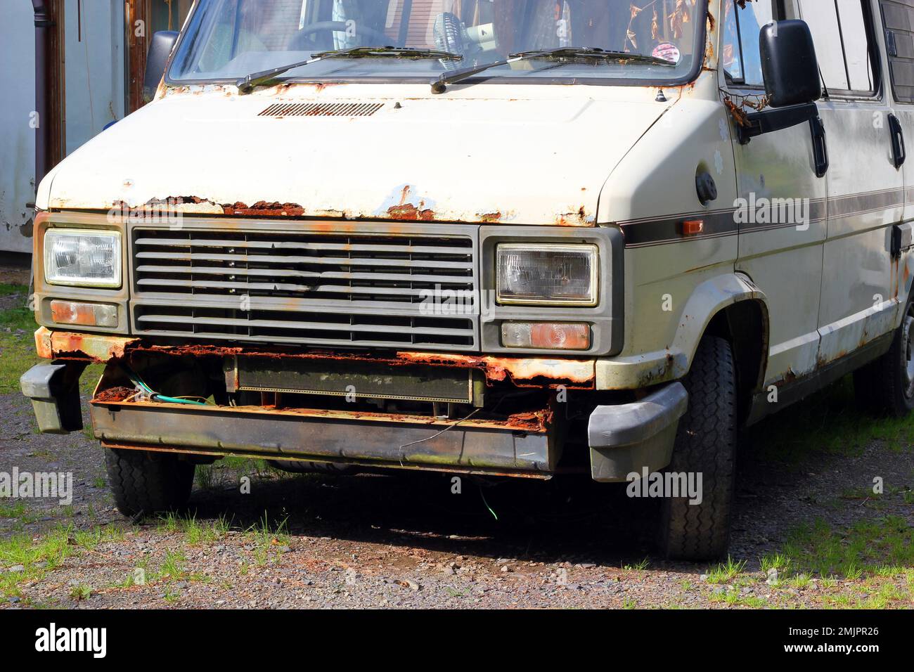 Rusty old motor vehicle. Van in very bad condition. Stock Photo