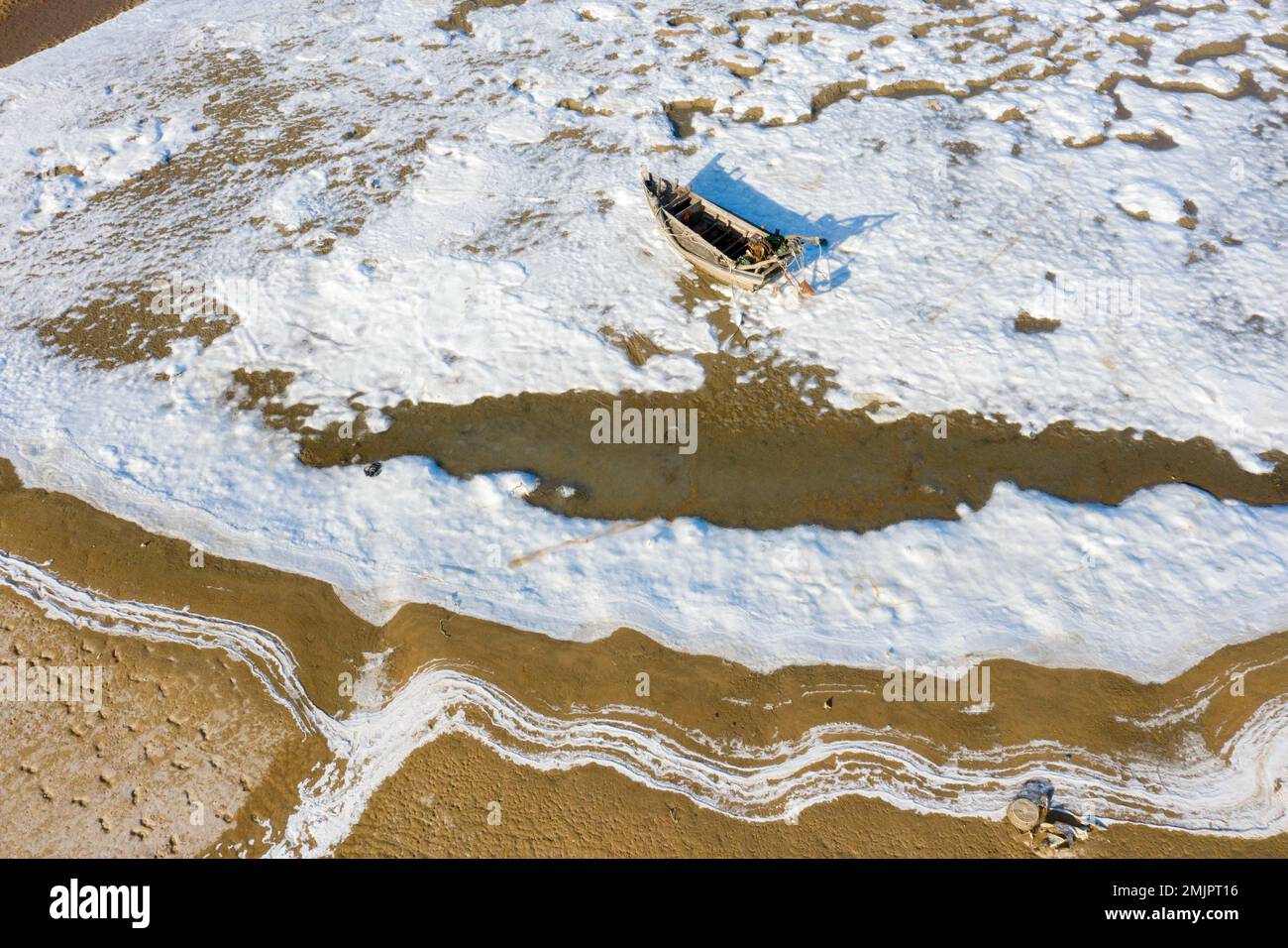 Aerial photo shows the fishing boats were frozen on the beach in the ...