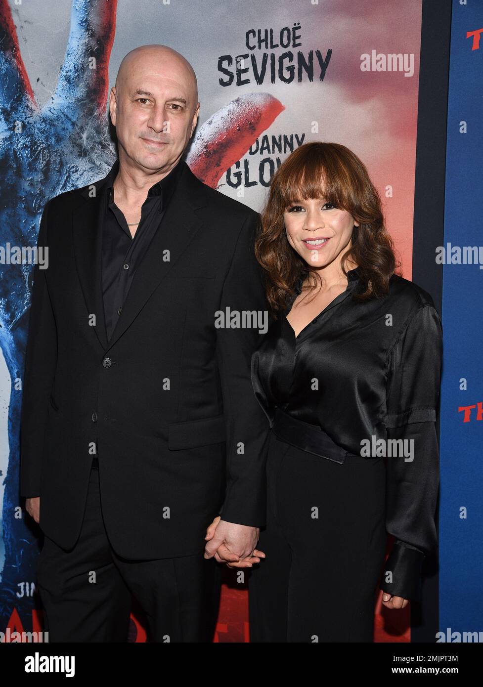 Actress Rosie Perez, right, and husband Eric Haze attend the premiere