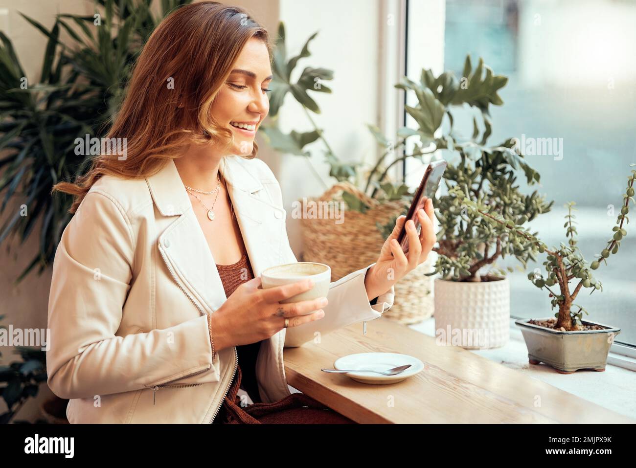Coffee shop, phone and social media with a woman customer drinking