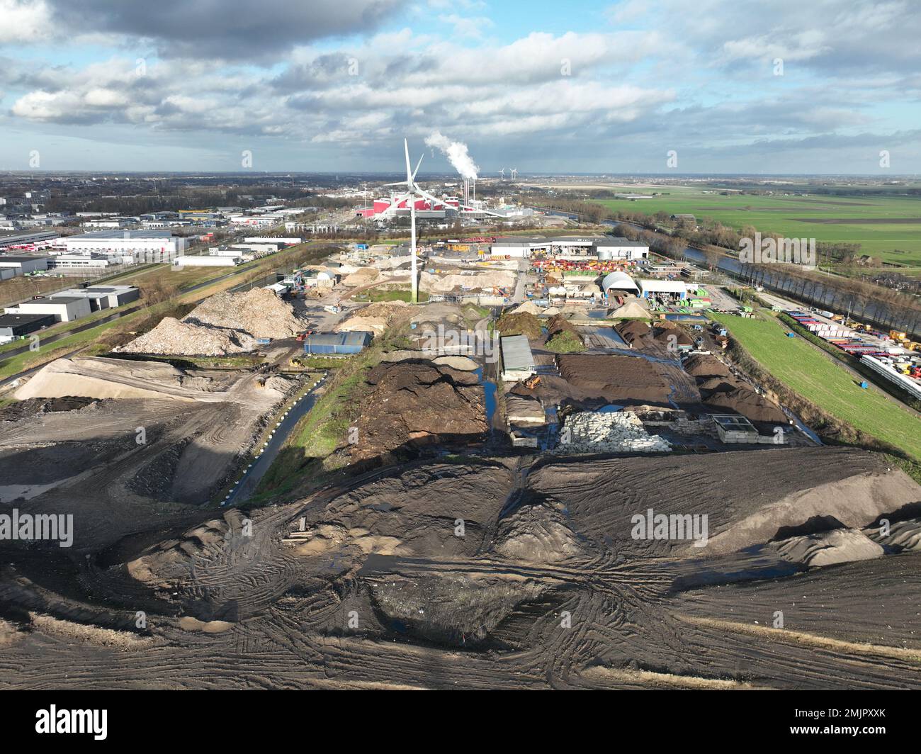 Landfill dumping ground, heaps of waste in compund facility in Alkmaar, The Netherlands. Containers for collection and segmentation. Aerial. Stock Photo