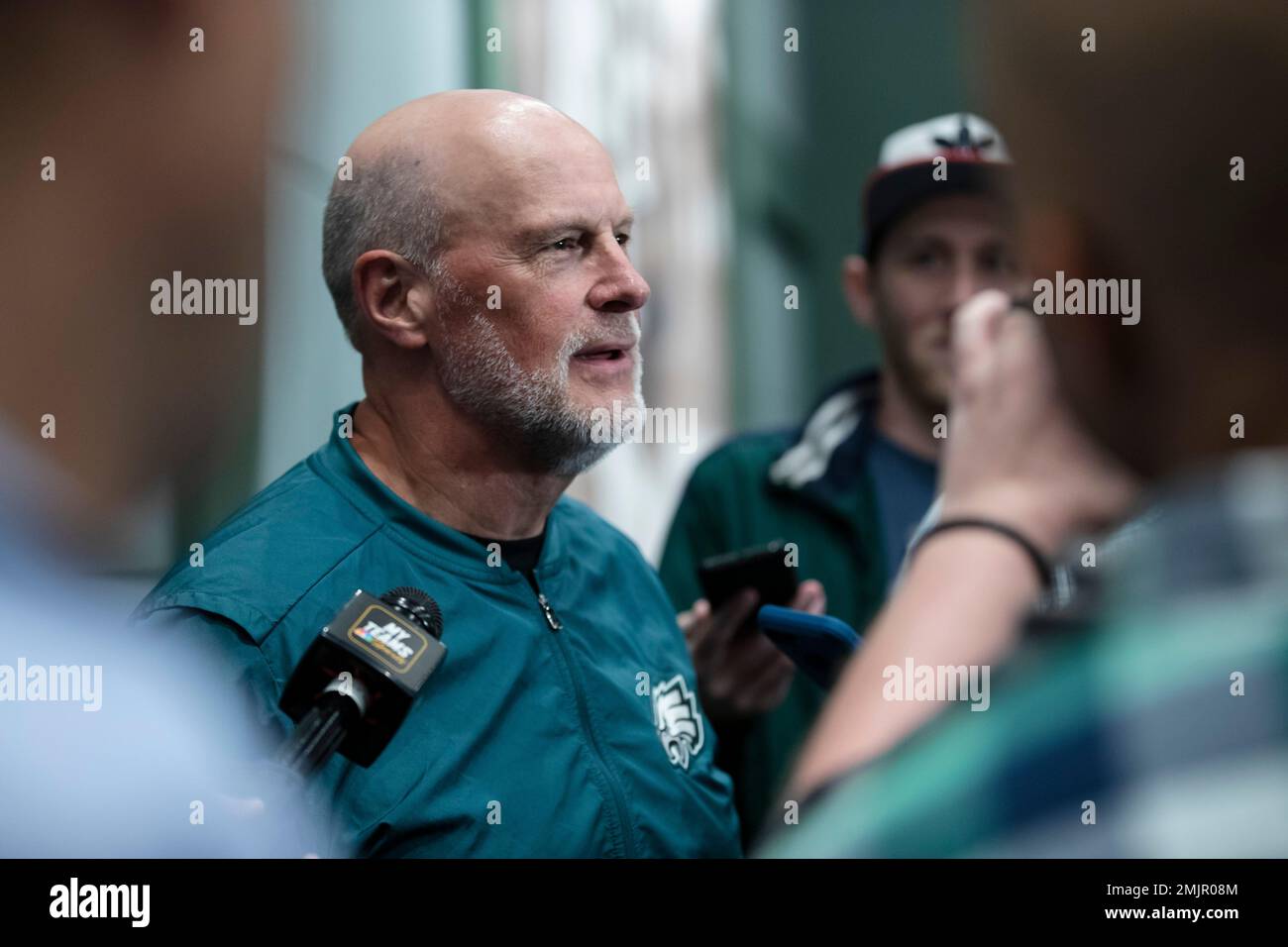 Philadelphia Eagles linebackers coach Ken Flajole speaks with members