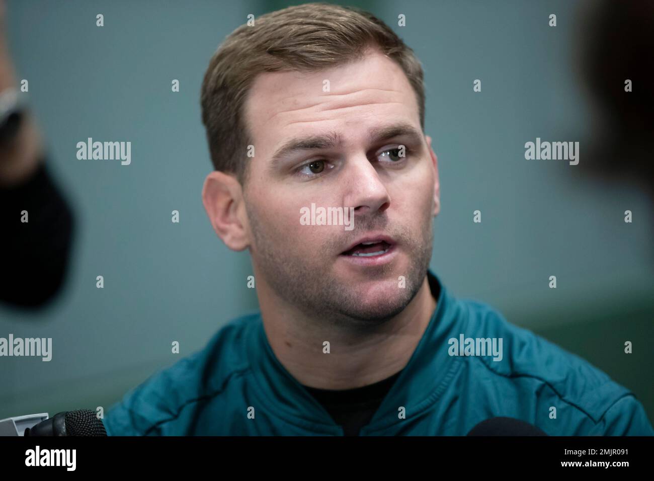 Philadelphia Eagles quarterbacks coach Press Taylor speaks with members