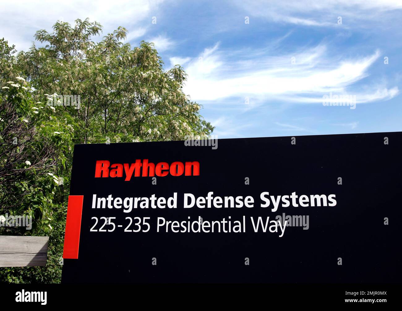 A sign stands at the driveway into Raytheon's Integrated Defense