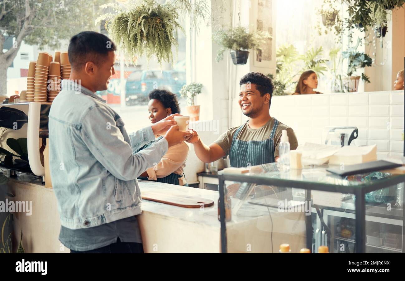 Barista, coffee shop and service worker in the morning with customer in a restaurant. Happy