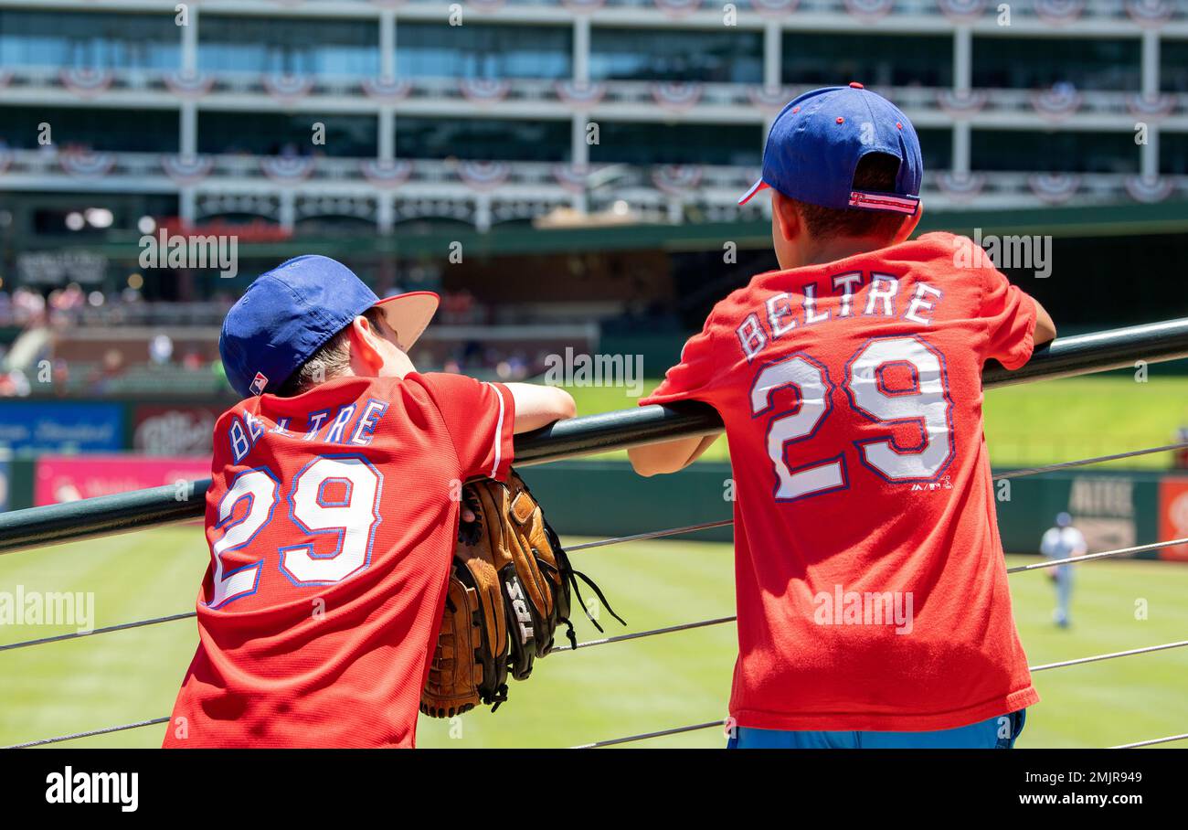 Young Texas Rangers fans wearing Adrian Beltre jerseys watch the