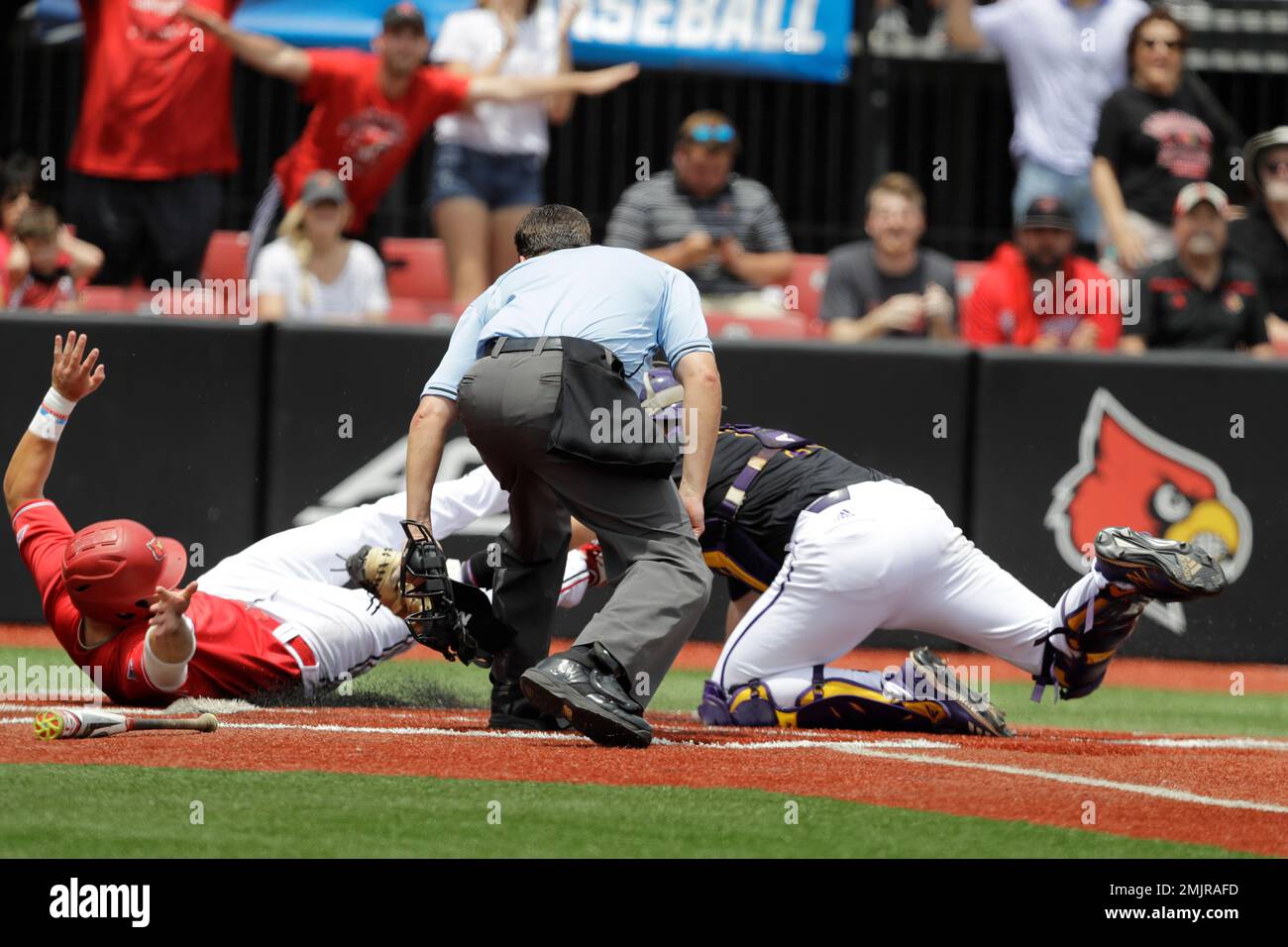Louisville's Justin Lavey slides safe under the tag of East Carolina's Jake  Washer during the third inning in Game 2 of the NCAA college baseball super  regional tournament, Saturday, June 8, 2019