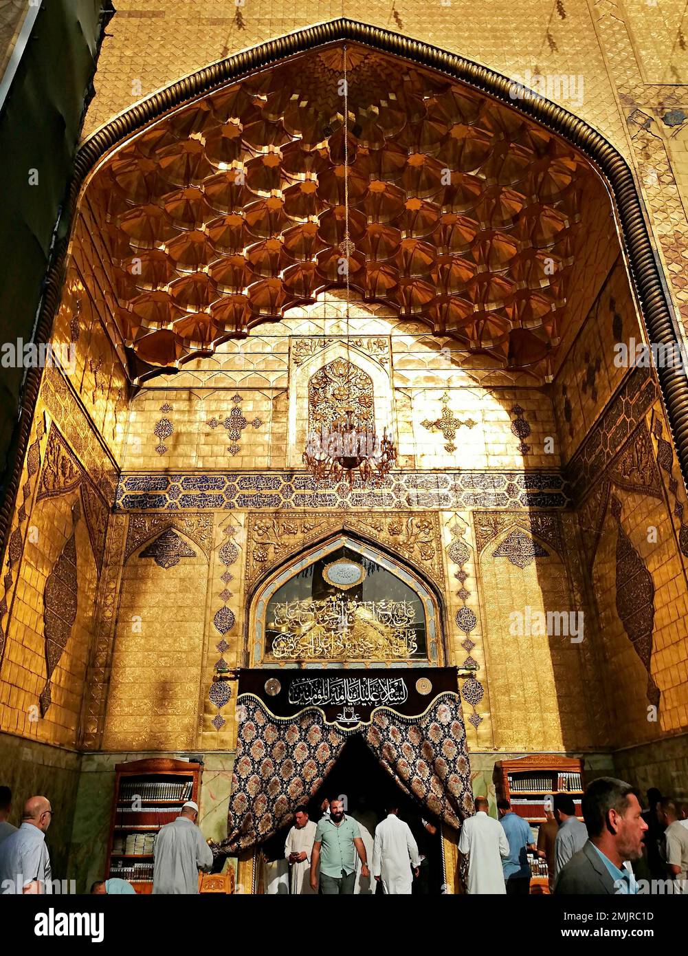 Shiite Muslim worshippers pray inside the holy shrine of Imam Ali, the