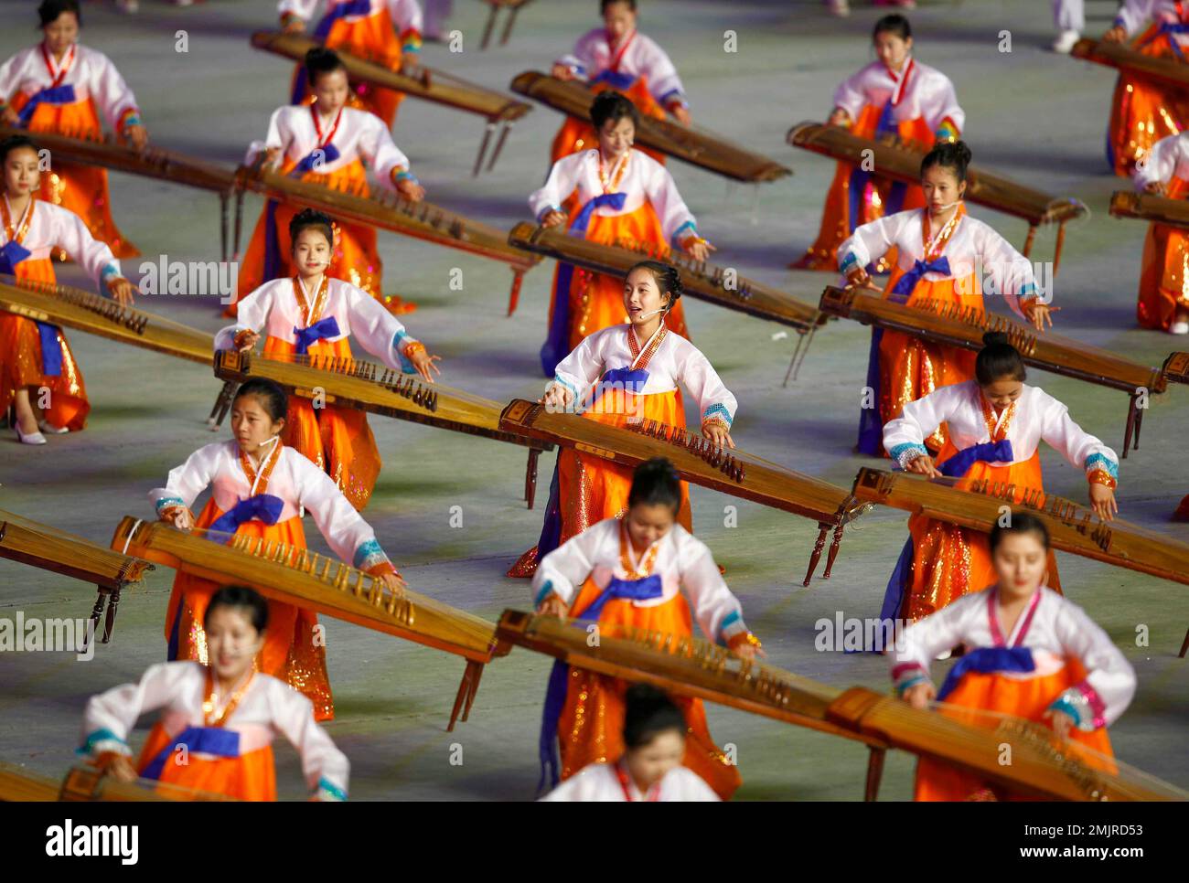 Women play Korean traditional musical instrument Kayagum during mass