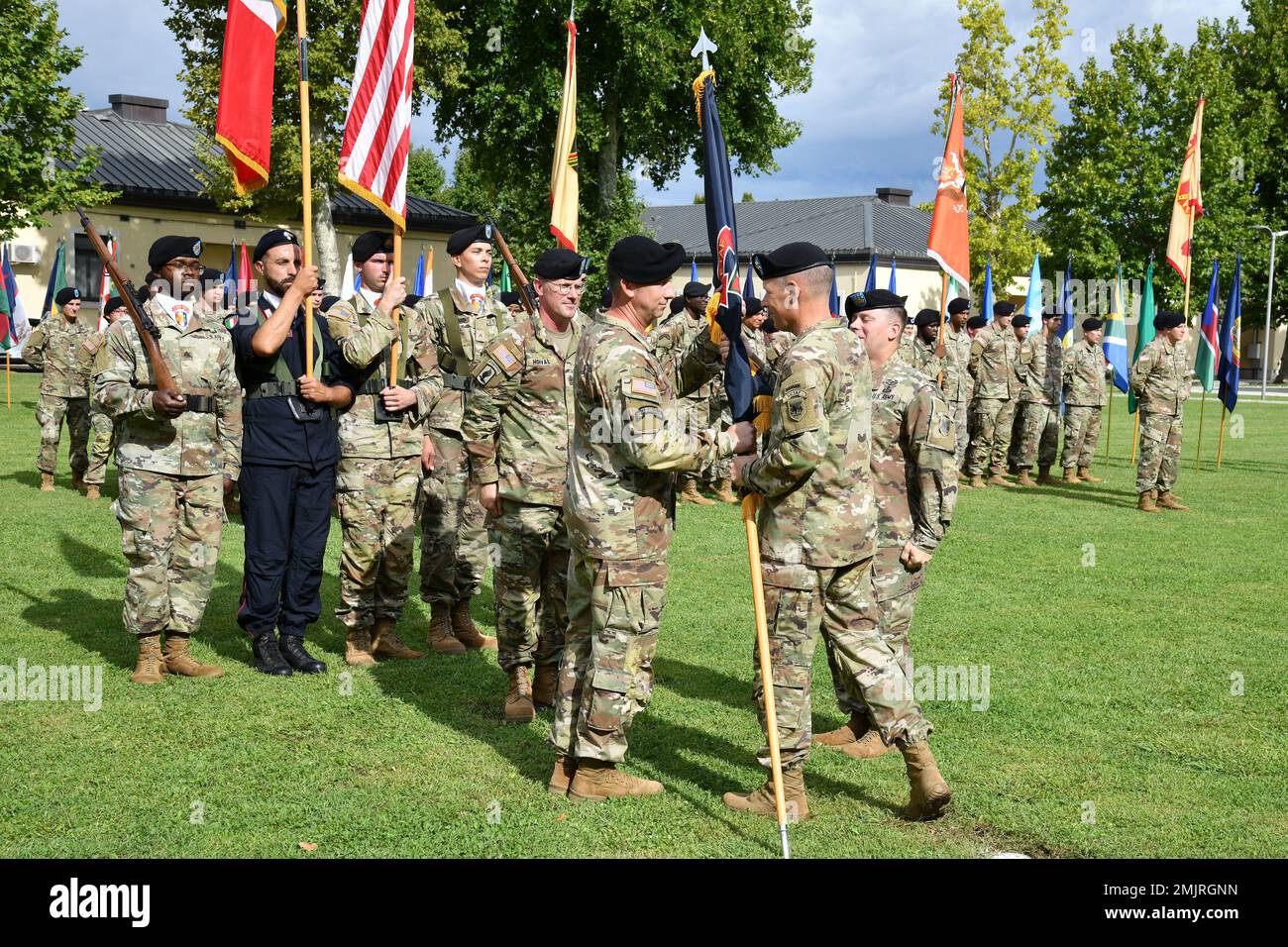 Maj. Gen. Todd Wasmund, U.S. Army Southern European Task Force, Africa commander, passes the U.S. Army Southern European Task Force, Africa colors to Command Sergeant Major Reese W. Teakell, incoming Command Sgt. Major., during the SETAF-AF Change of Responsibility Ceremony at Caserma Ederle in Vicenza, Italy, September 1, 2022. Stock Photo