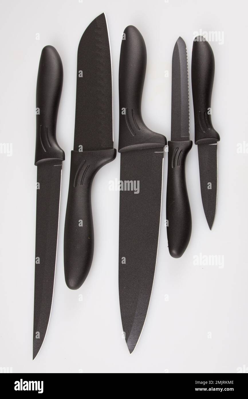 black kitchen knives set isolated against white background Stock Photo