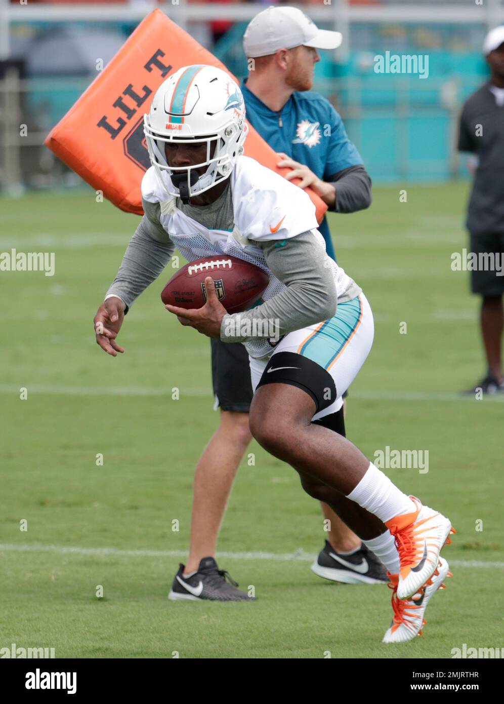 FILE - In this Sept. 8, 2019, file photo, Miami Dolphins running back Mark  Walton (22) warms up before an NFL football game against the Baltimore  Ravens, in Miami Gardens, Fla. The