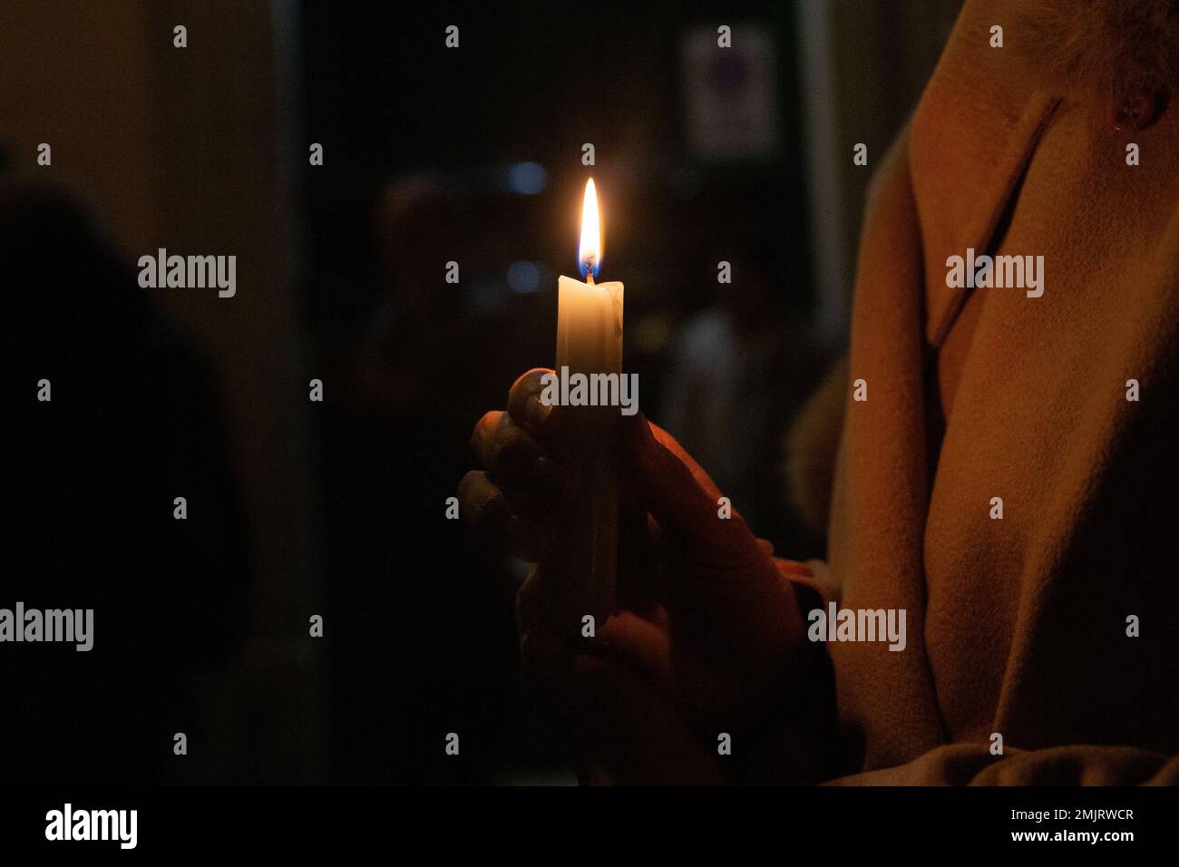 Rome, Italy. 27th Jan, 2023. A woman holds a candle during the candlelight vigil to remember the massacres carried out by Nazi fascism against Rom-Sinti people, homosexuals and disabled people (Photo by Matteo Nardone/Pacific Press) Credit: Pacific Press Media Production Corp./Alamy Live News Stock Photo