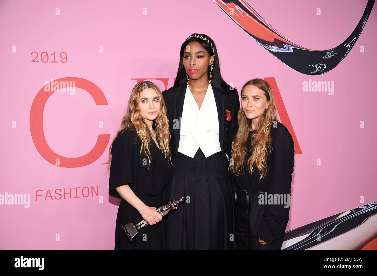 Jessica Williams, center, poses with winners Ashley Olsen, left, and