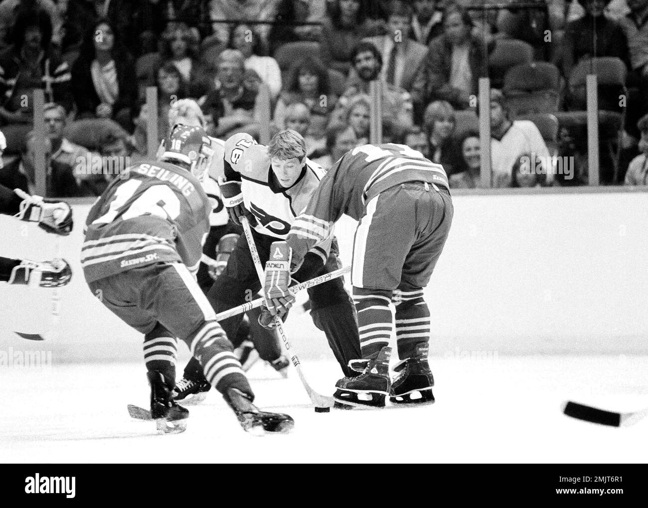 Philadelphia Flyers Bobby Clarke, left, collides with Toronto Maple Leafs  Dan Daust as they battle for the puck during first period NHL action in  Philadelphia, March 25, 1983. The Flyers won 7-4. (