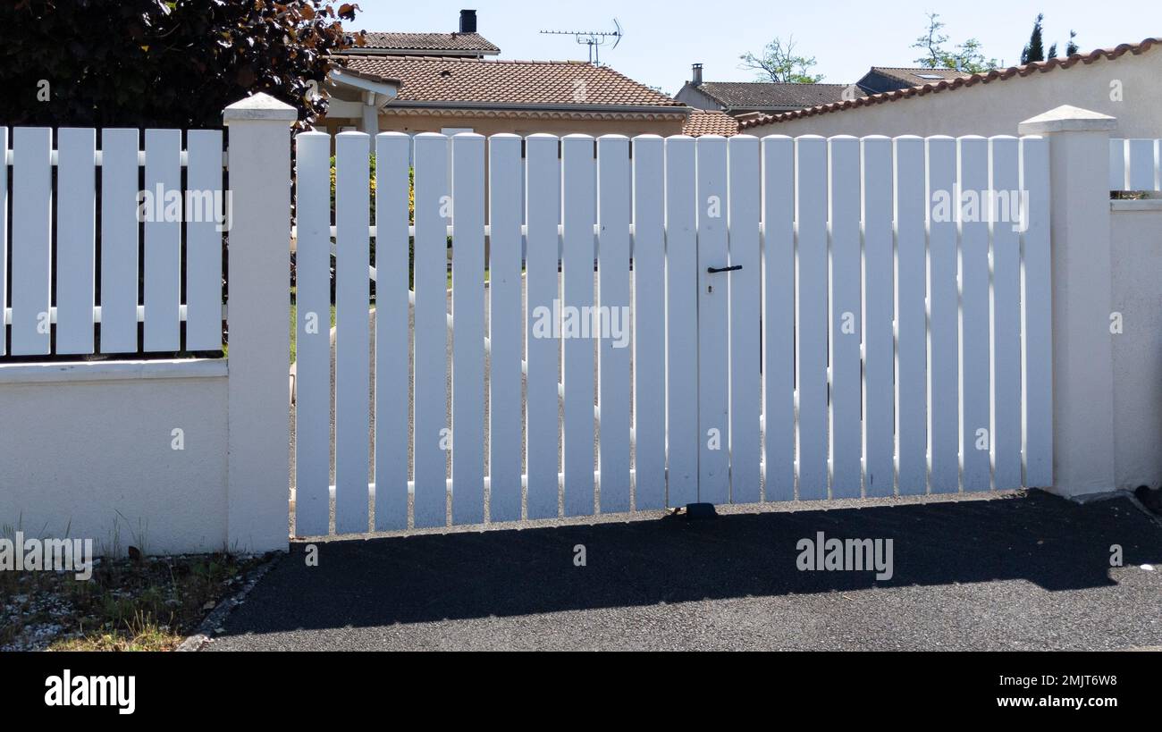 modern fence white gate aluminum portal with blades design of suburban house Stock Photo