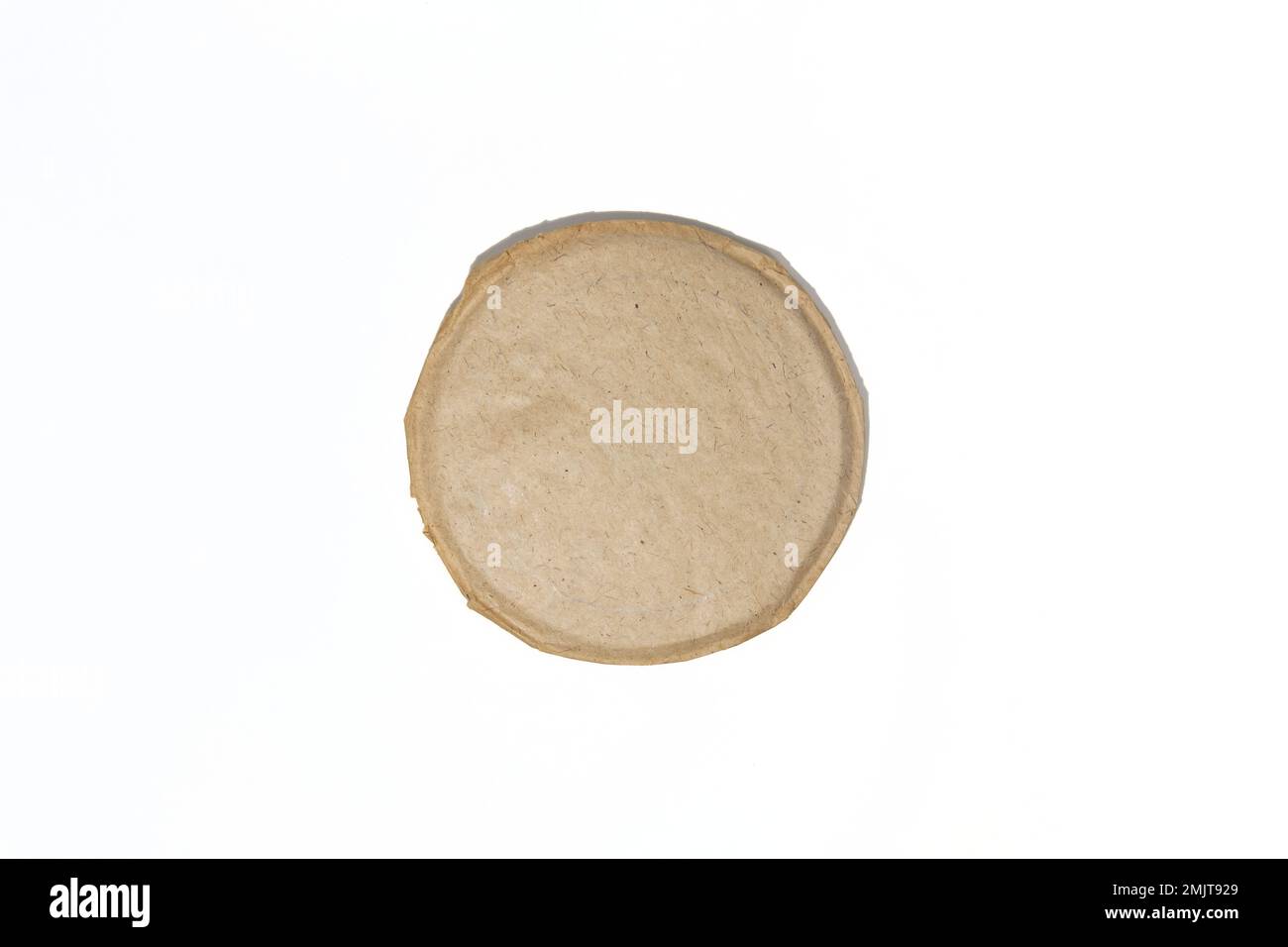 Torn sheet of old round paper. Round piece of torn vintage paper Stock