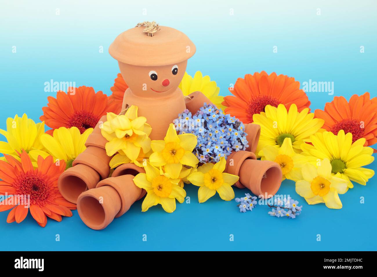 Flowerpot man terracotta garden ornament with Spring flowers. Recycled