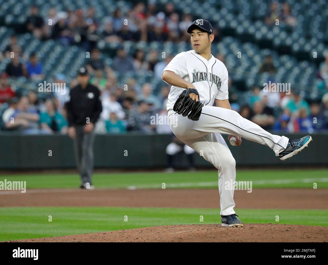 Seattle Mariners starting pitcher Yusei Kikuchi begins his windup