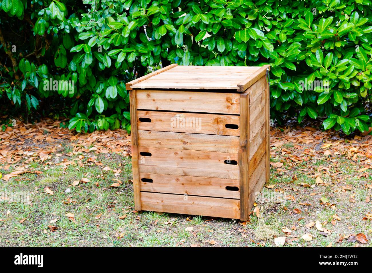 wooden garden compost bin of organic material composter Stock Photo Alamy
