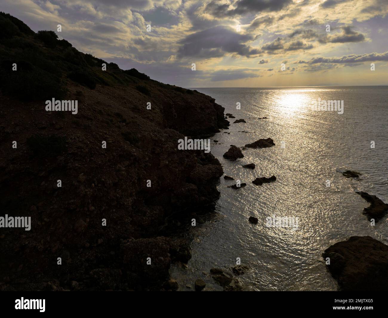 Sunset in Greek coasts Stock Photo