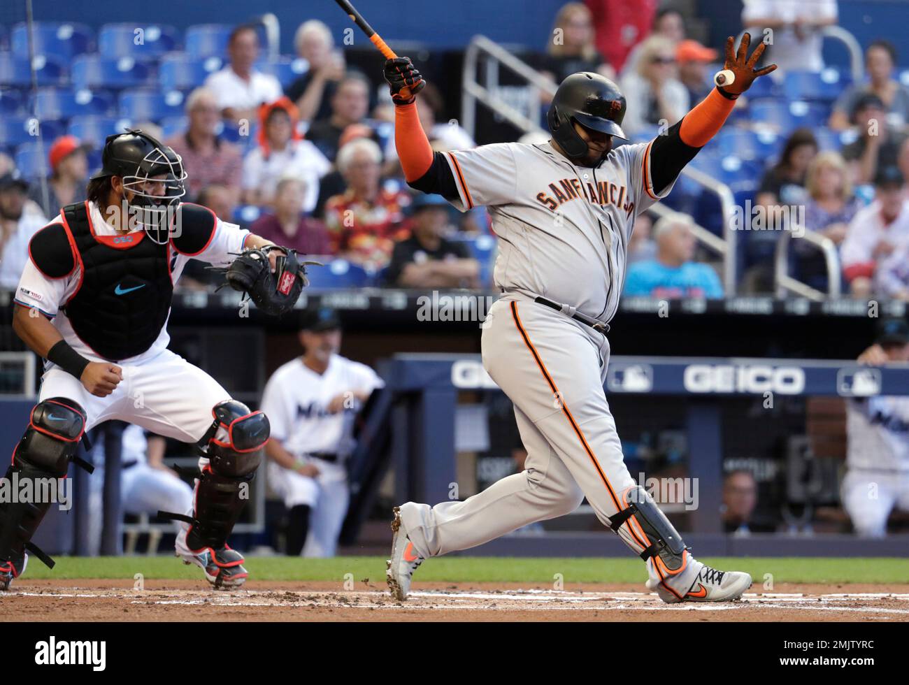 San Francisco Giants' Pablo Sandoval, right, strikes out during the first  inning of the team's baseball game against the Miami Marlins, Wednesday,  May 29, 2019, in Miami. At left is Marlins catcher