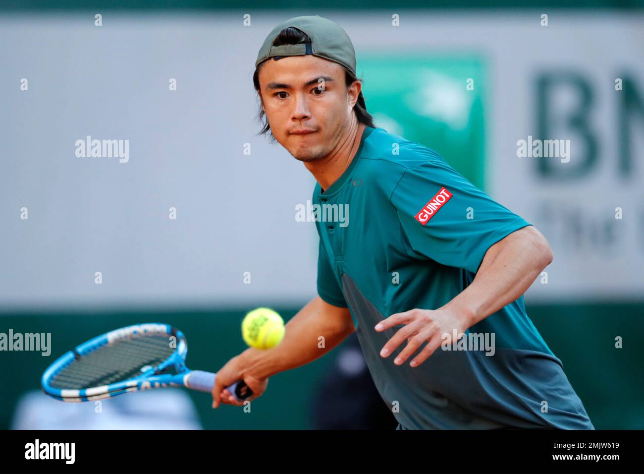 Japan's Taro Daniel plays a shot against France's Gael Monfils during their  first round match of the French Open tennis tournament at the Roland Garros  stadium in Paris, Tuesday, May 28, 2019. (