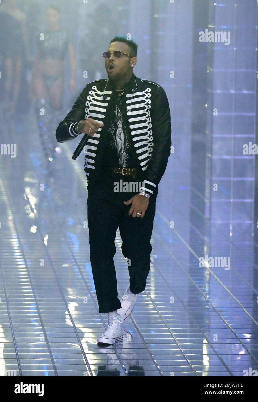 FILE - In this Sept. 21, 2018 file photo, US rapper Chris Brown performs  during Philipp Plein's women's 2019 Spring-Summer collection, unveiled  during the Fashion Week in Milan, Italy. The lawyer for