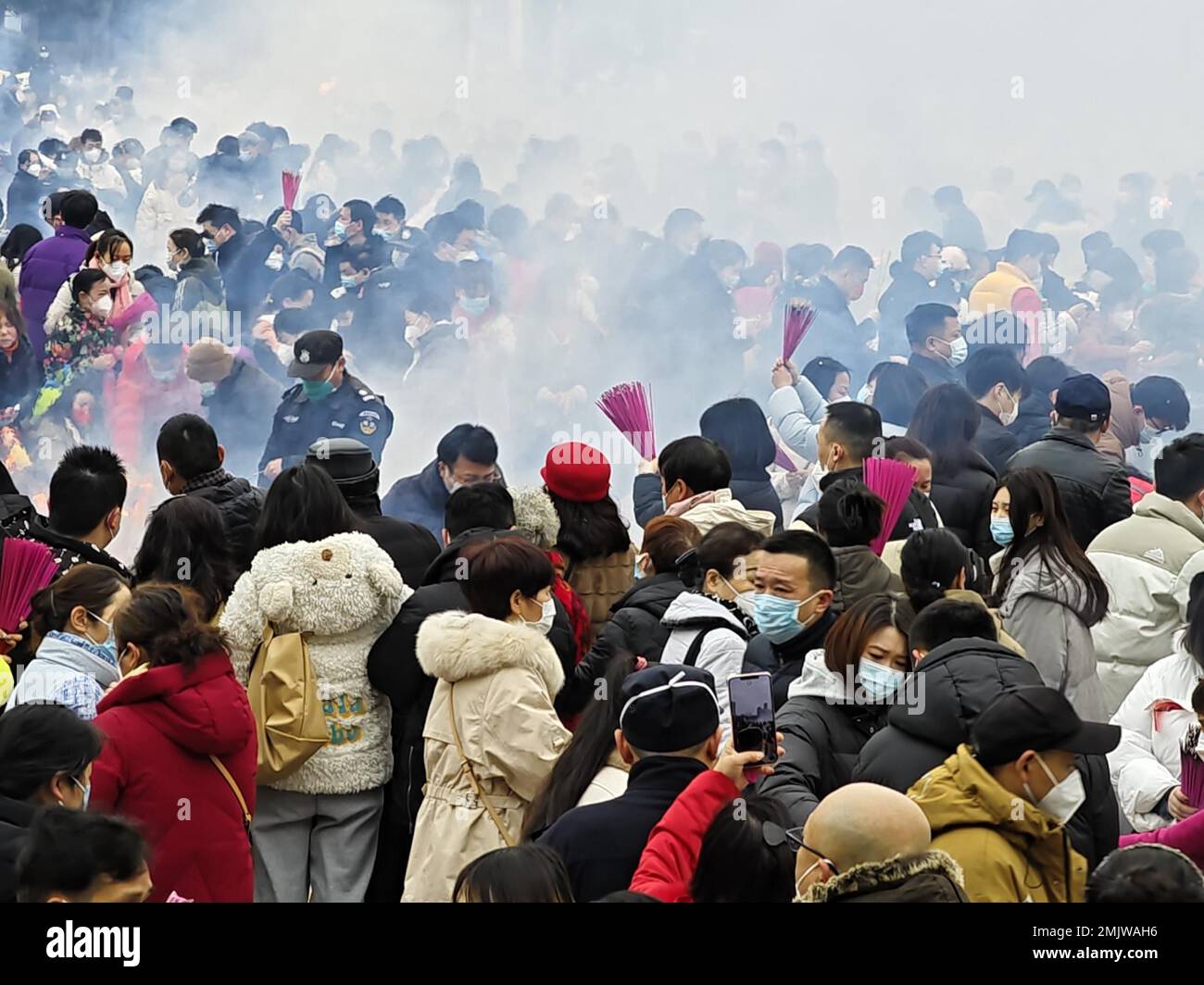 People burn incense sticks and pray for wealth at Guiyuan Buddhist ...