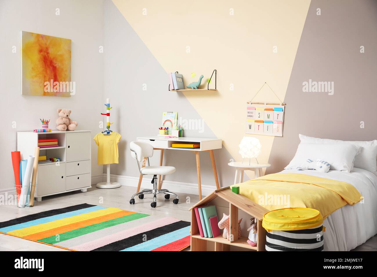Stylish child room interior with comfortable bed and desk Stock Photo ...