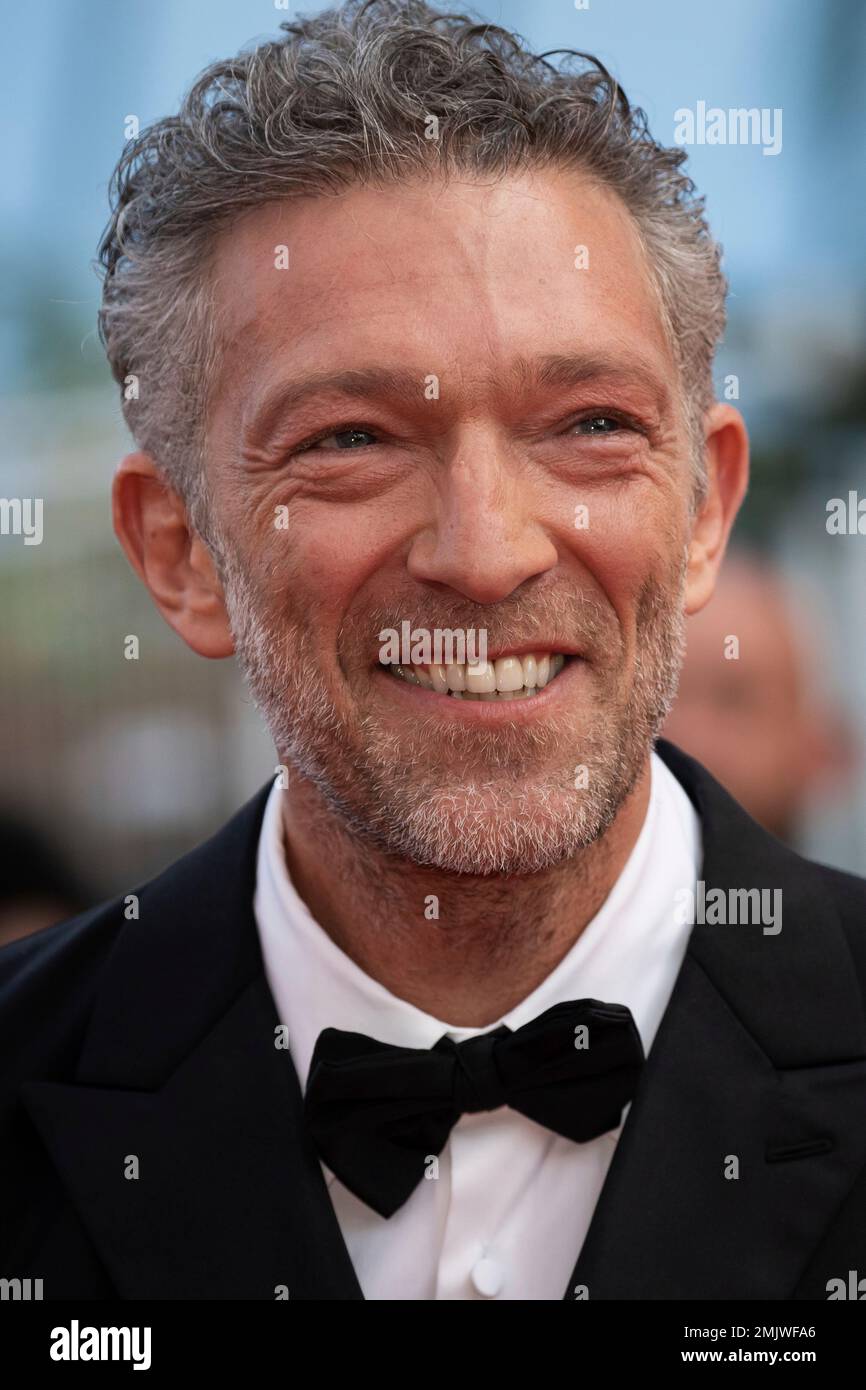Actor Vincent Cassel poses for photographers upon arrival at the awards