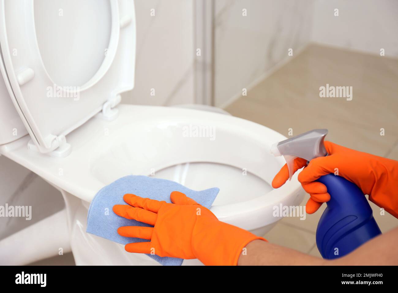 https://c8.alamy.com/comp/2MJWFH0/woman-cleaning-toilet-bowl-in-bathroom-closeup-2MJWFH0.jpg