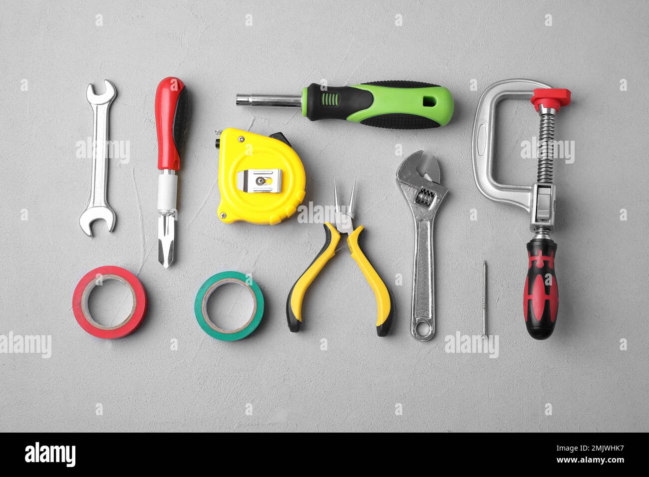 Flat lay composition with construction tools on light grey background ...