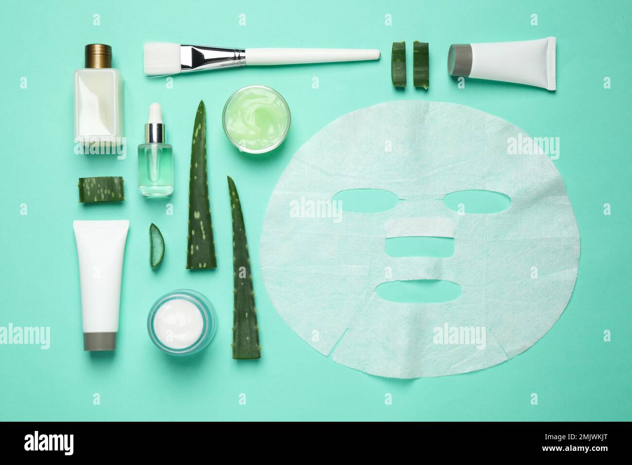 Flat lay composition with different cosmetic products and aloe on ...