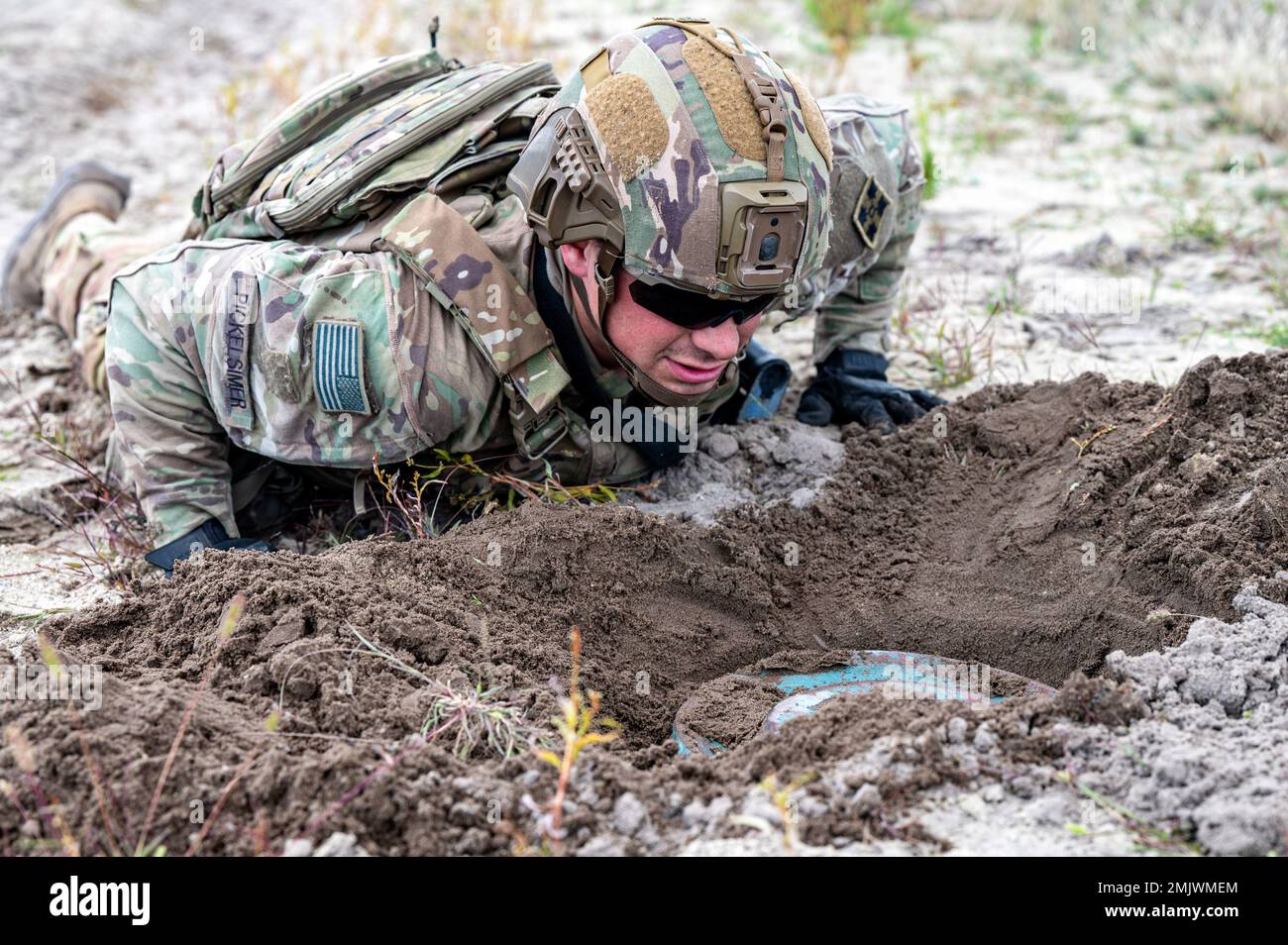 U.S. Army Sgt. Ethan Pickelsimer, a Wisconsin native and combat engineer explosive ordinance clearance agent, with 588th Brigade Engineer Battalion, 3rd Brigade Combat Team, 4th Infantry Division, confirms the discovery of an inert anti-tank mine during a platoon live fire and route clearance training at Trzebien, Poland, Sept. 1, 2022. The 3/4th ABCT is among other units assigned to 1st Infantry Division, proudly working alongside NATO allies and regional security partners to provide combat-credible forces to V Corps, America's forward-deployed corps in Europe. Stock Photo