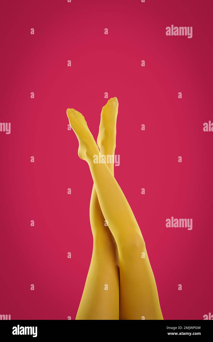 Woman wearing red tights on yellow background, closeup of legs Stock Photo  - Alamy