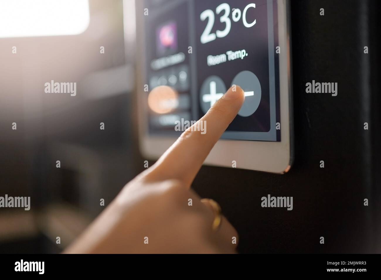 Smart home system, wall and woman hands with digital app monitor for thermostat heating, temperature control or house automation. Future AI software Stock Photo