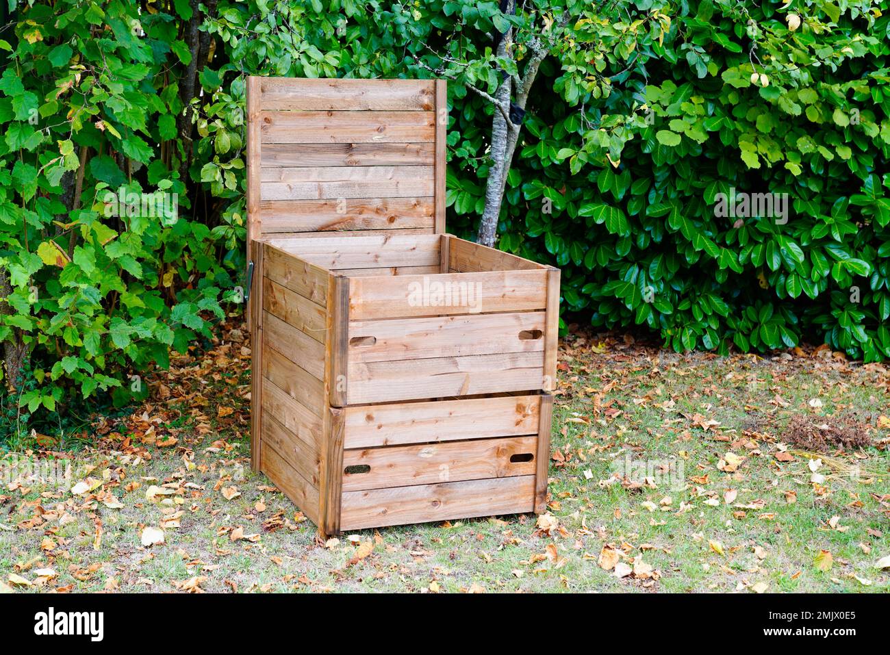 wooden compost bin in home garden for recycling organic material Stock