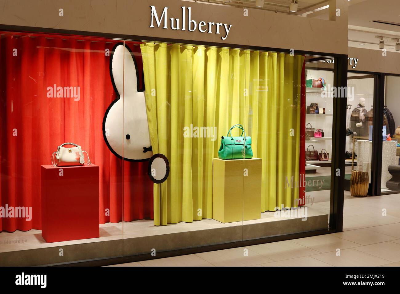 TOKYO, JAPAN - January 19, 2023: Mulberry store window display in Tokyo's Ginza area featuring Mulberry x Miffy products. Stock Photo