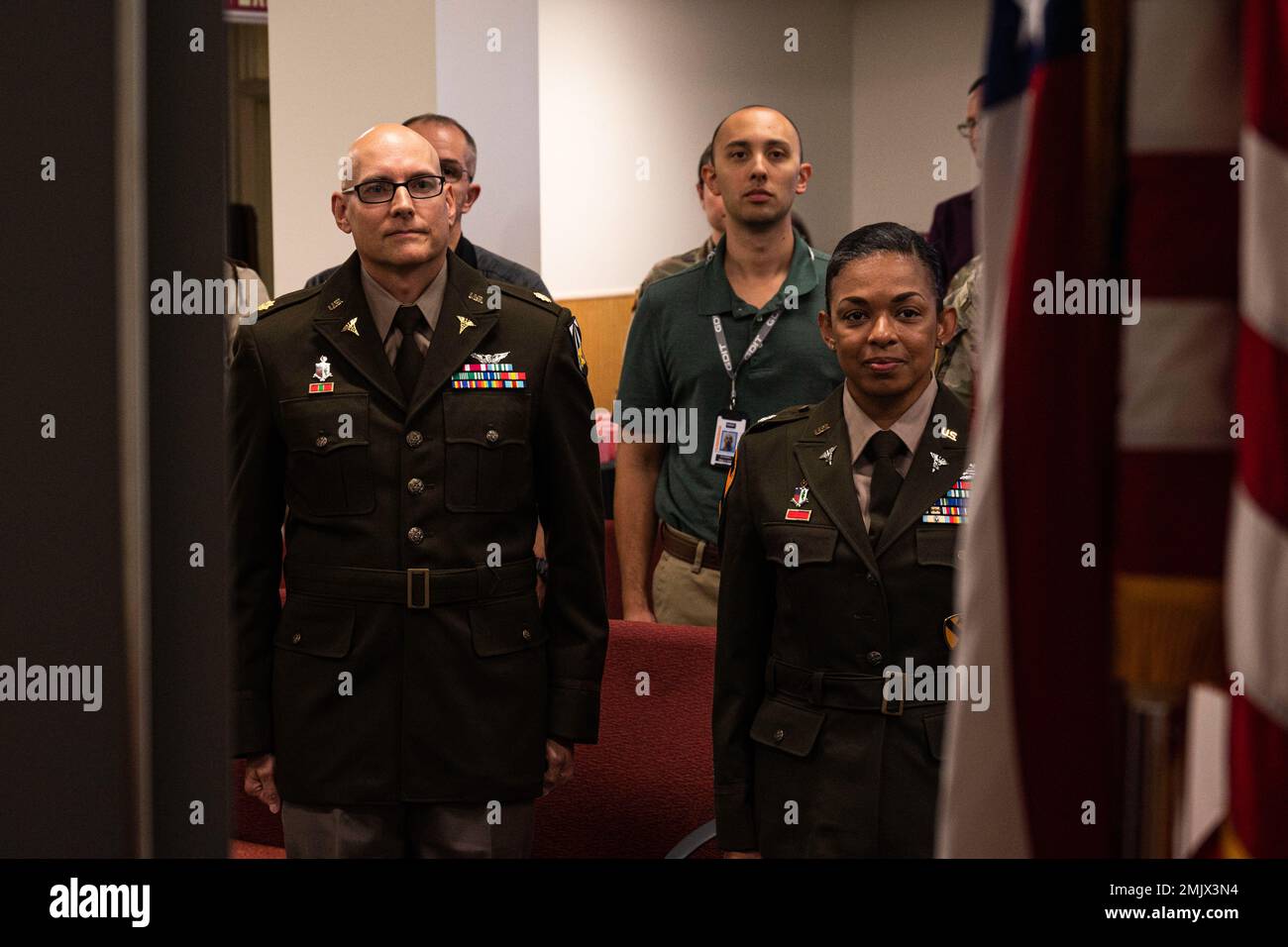Maj. Daniel Rhoades and his wife, Lt. Col. Kimi Damassia-Rhoades, stand ...