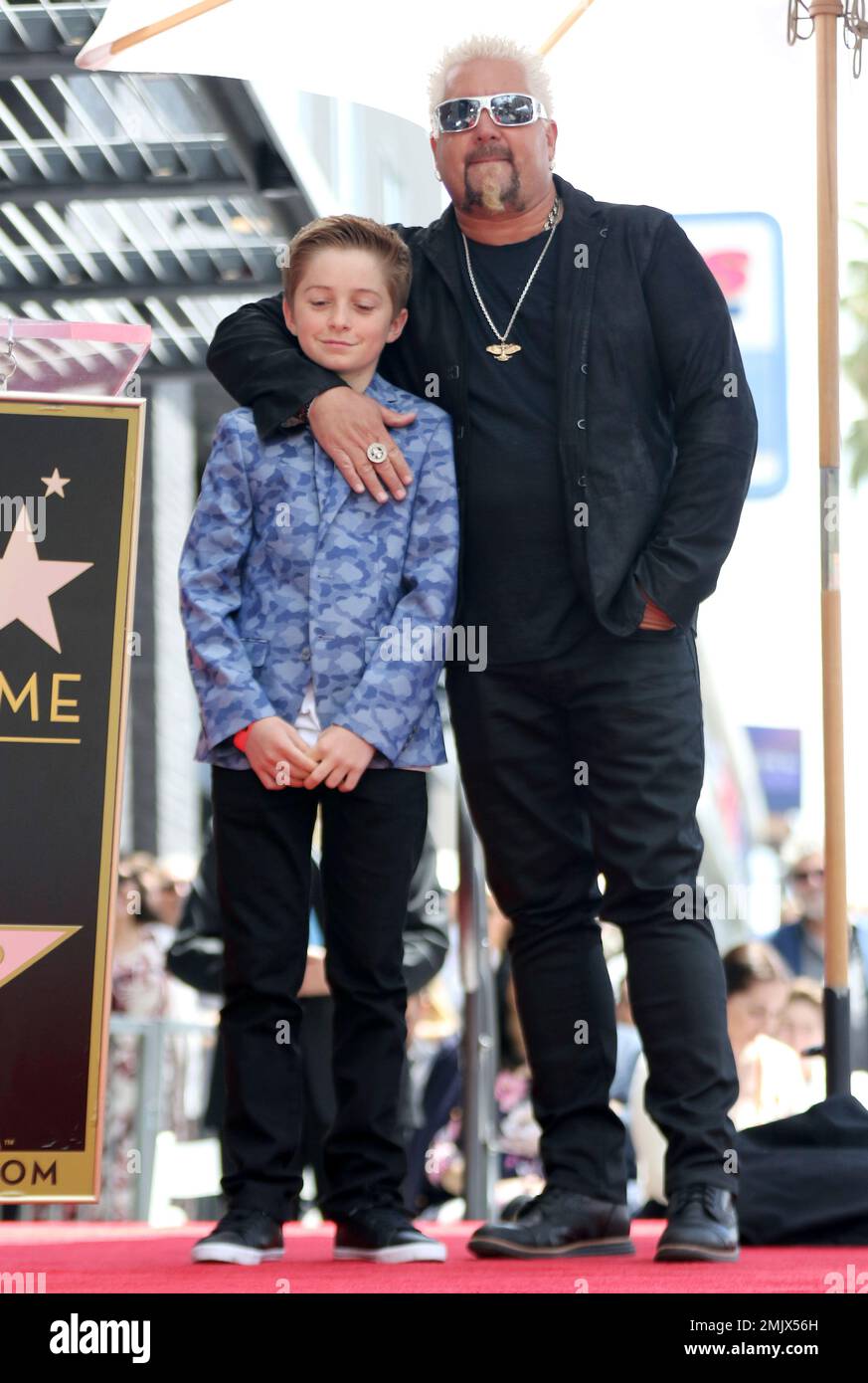Guy Fieri, right, hugs his son Ryder Fieri at a ceremony honoring Guy ...