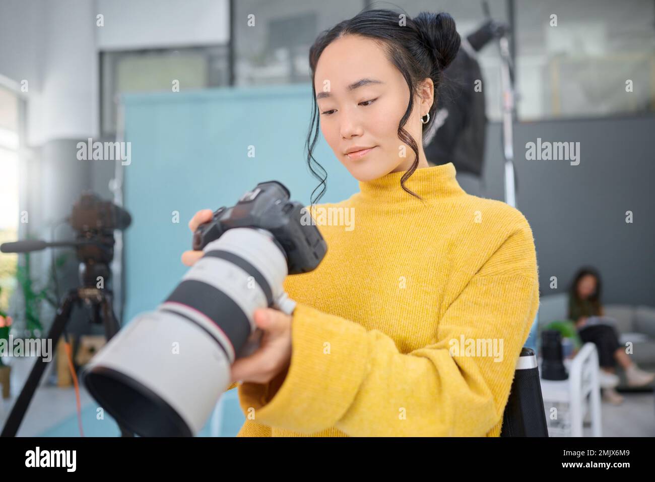 Photography camera, asian woman and digital agency worker review ...