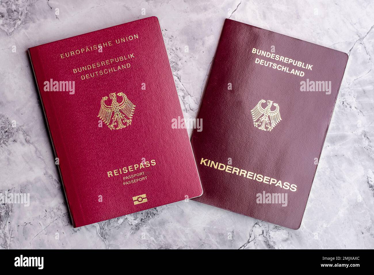 German and Turkish passports on the marble floor. Travel to Germany